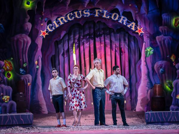 Circus Flora company on stage beneath the Circus Flora arch